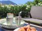 G&icirc;te &agrave; Porto Vecchio, le Sud Corse, labellis&eacute; G&icirc;tes de France : instant d&eacute;tente sur la terrasse &agrave; l'arri&egrave;re de la maison 