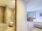 Gite &agrave; Afa, Le Grand Ajaccio, Corse du Sud, labellis&eacute; G&icirc;tes de France : la  chambre avec la salle de bain en rez-de-jardin